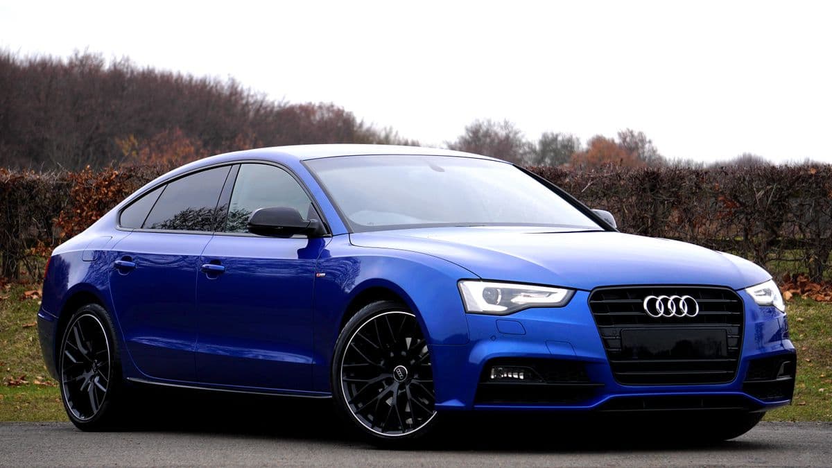Blue Audi with black low-profile alloy wheels, a common rim damage risk repaired at Speedline Mags
