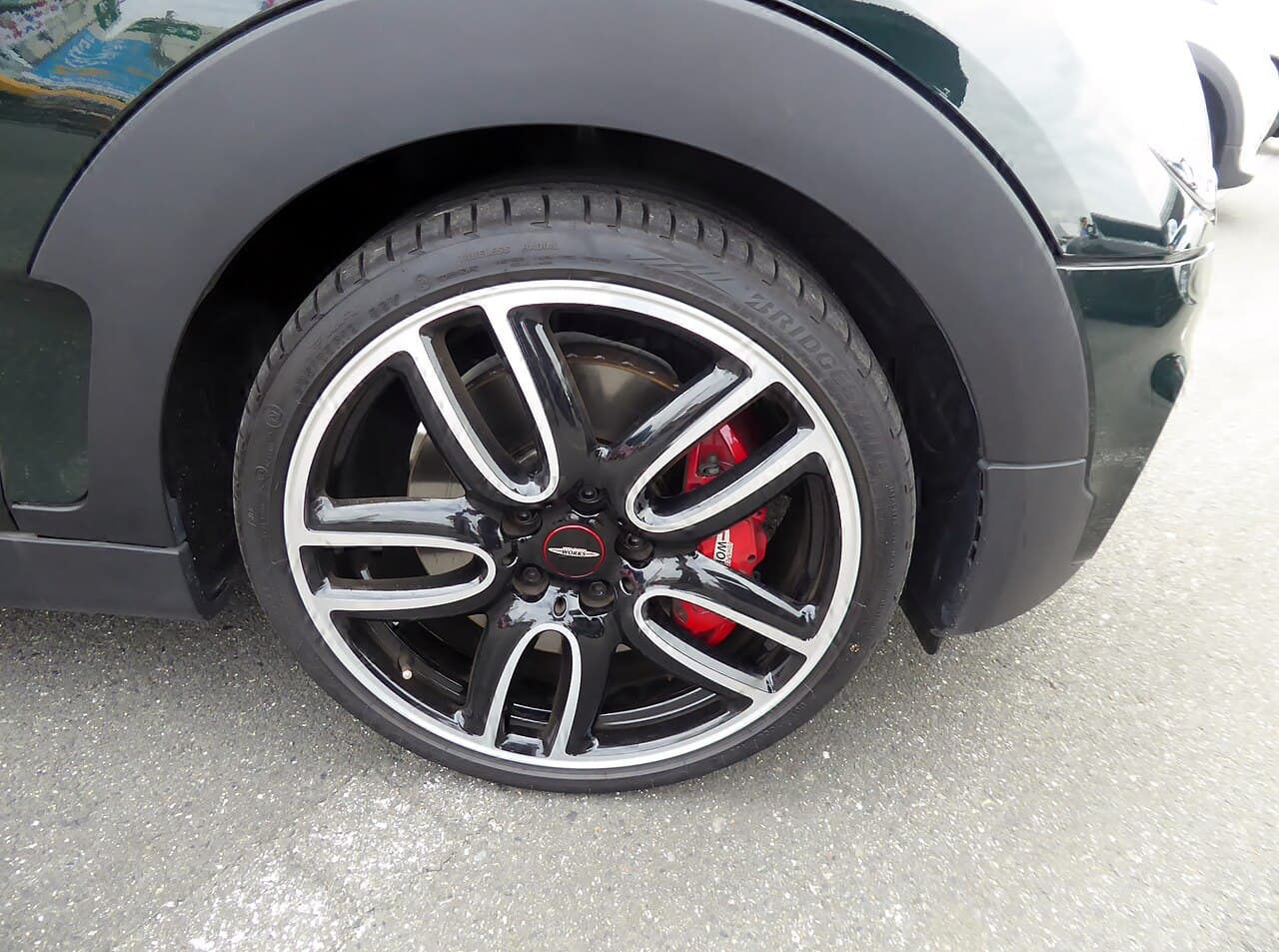 Mini John Cooper Works diamond cut alloy wheel with red caliper repaired at Speedline Mags Cape Town